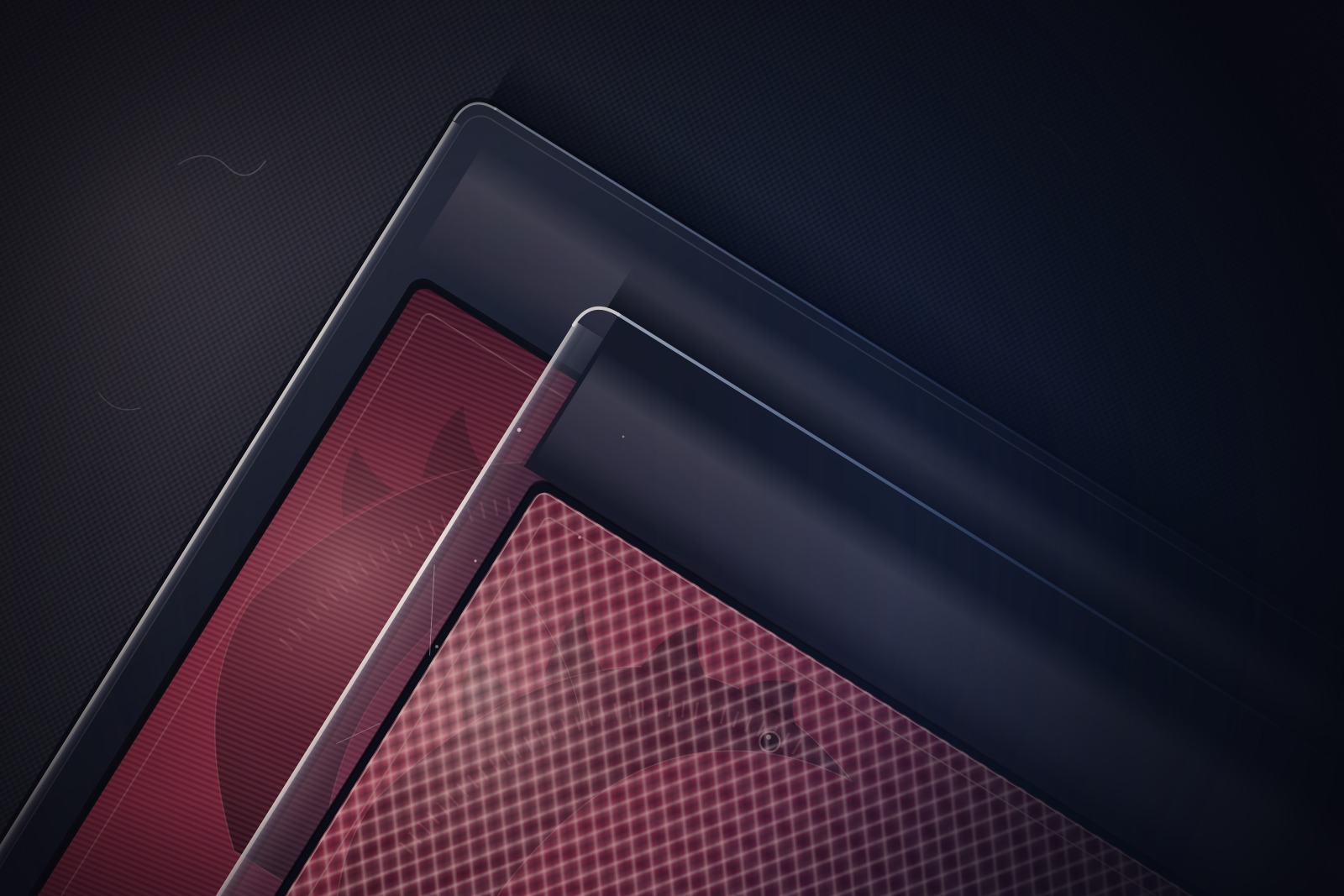 Extreme close-up of the corners of two overlapping graded slabs on dark felt, showing two slightly different burgundy foil patterns catching a low raking light.